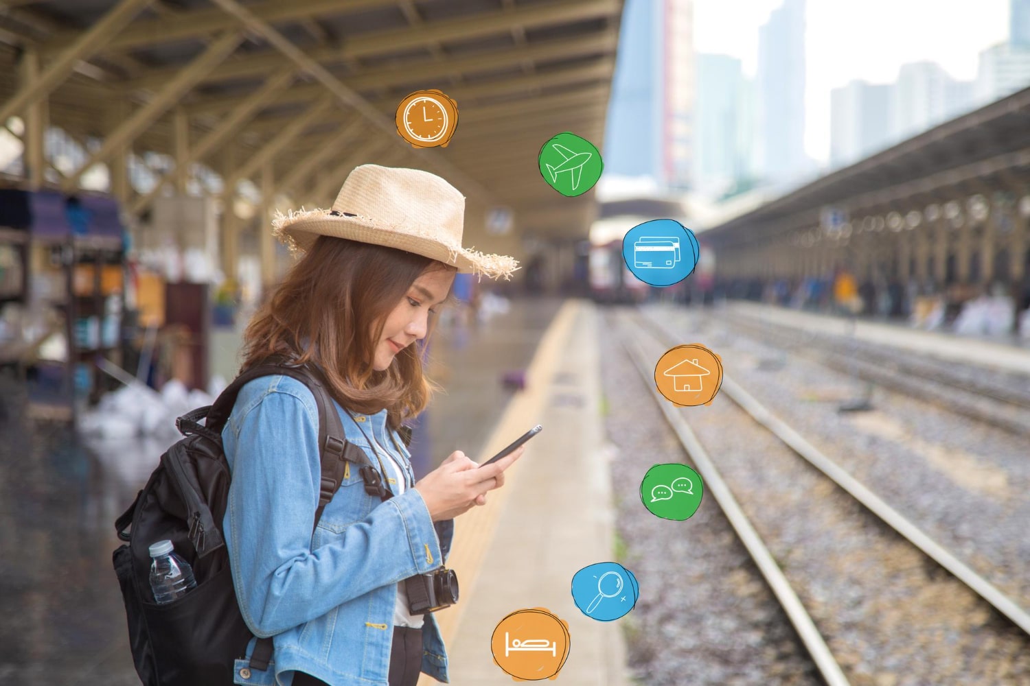A young traveler at a train station checks her smartphone while colorful travel-related icons float around her, representing chatbot features for businesses.