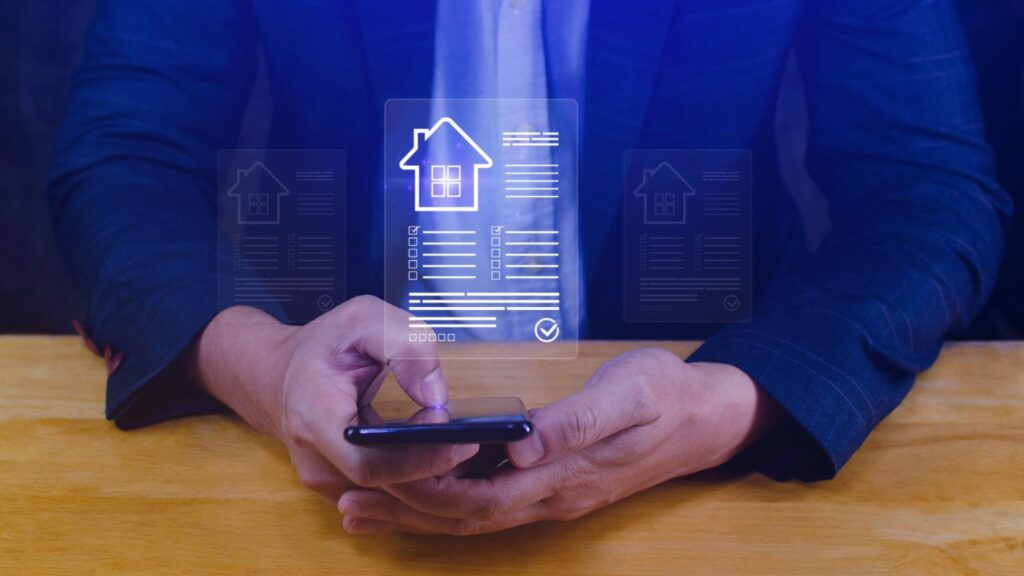 A person in a suit uses a smartphone with floating digital icons showing house documents, representing a chatbot for real estate assistance.